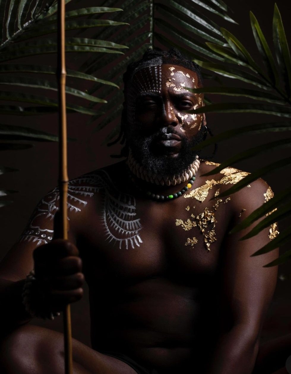 Daniel Lloyd in a striking jungle themed fashion editorial, showcasing strength, confidence and African inspired styling