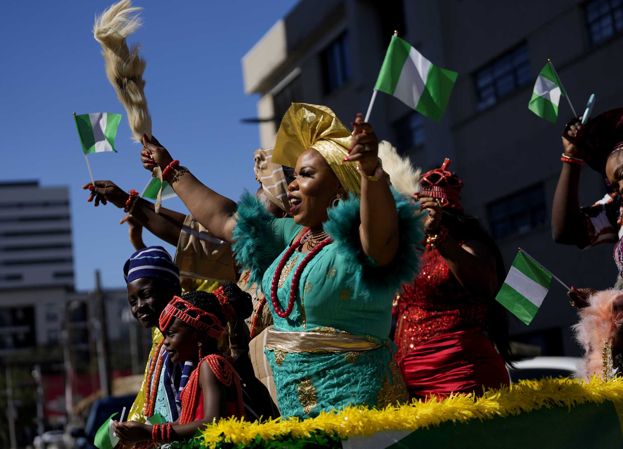 The Nigeria Cultural Parade participants and attendants celebrate the Nigerian Independence Day in Houston, Saturday, Oct. 1, 2022.