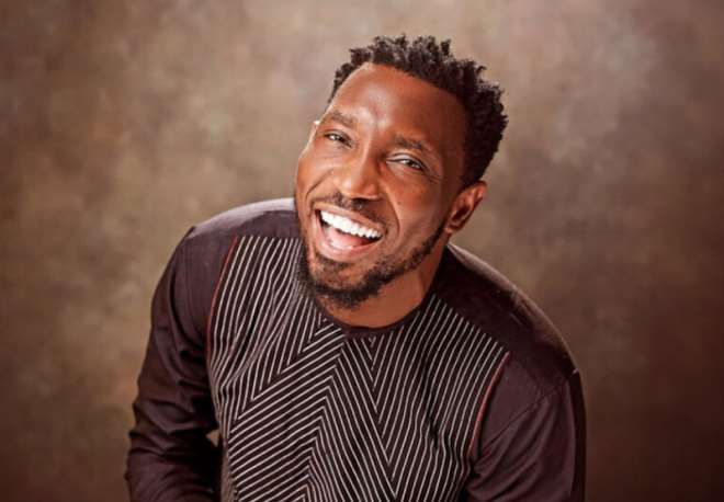 Timi Dakolo performing live on stage