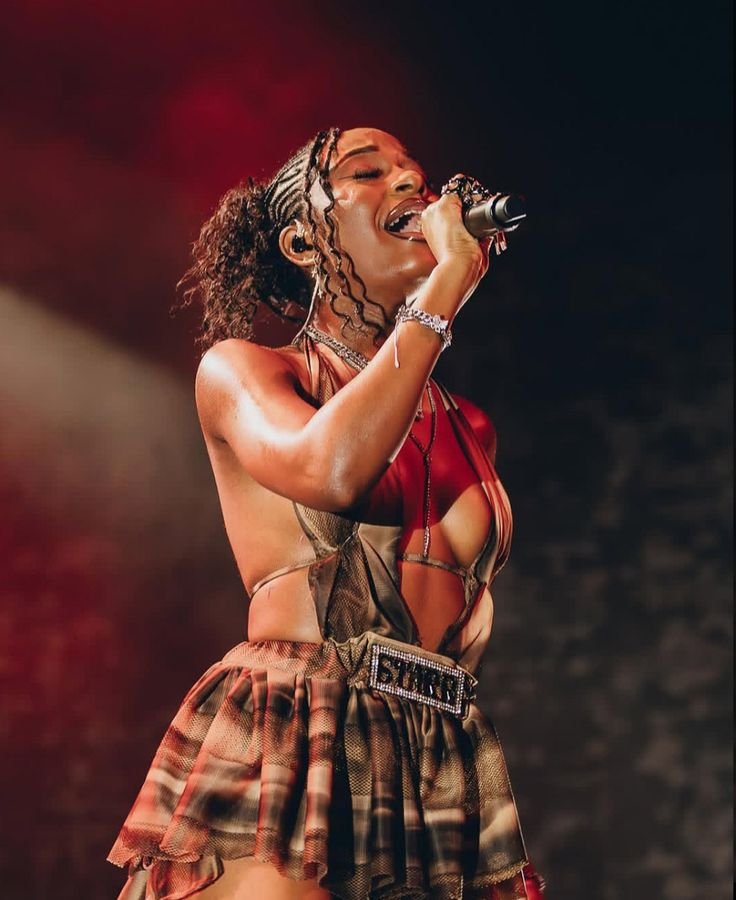 Ayra Starr performing on stage