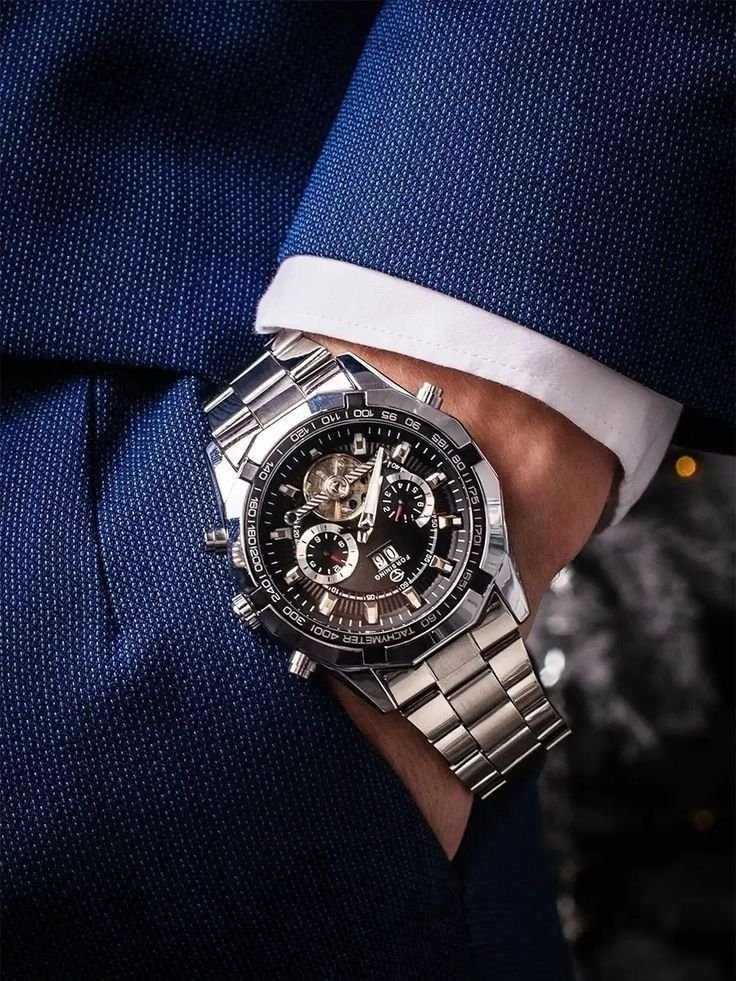 Man matching a wristwatch with his outfit, men's fashion and style coordination guide